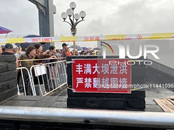 A protective fence is being installed at the first road pier at the Toudao wharf in Jilin City, Jilin province, China, on July 28, 2024. (