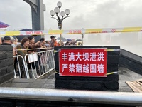 A protective fence is being installed at the first road pier at the Toudao wharf in Jilin City, Jilin province, China, on July 28, 2024. (