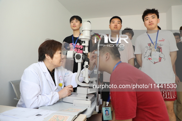 Young conscripts are attending a physical examination at a conscription medical examination station in Funing county, Yancheng city, East Ch...