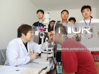 Young conscripts are attending a physical examination at a conscription medical examination station in Funing county, Yancheng city, East Ch...