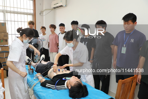 Young conscripts are attending a physical examination at a conscription medical examination station in Funing county, Yancheng city, East Ch...