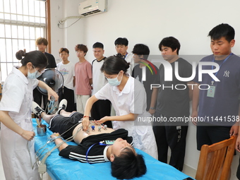 Young conscripts are attending a physical examination at a conscription medical examination station in Funing county, Yancheng city, East Ch...