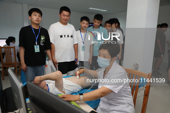 Young conscripts are attending a physical examination at a conscription medical examination station in Funing county, Yancheng city, East Ch...