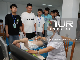 Young conscripts are attending a physical examination at a conscription medical examination station in Funing county, Yancheng city, East Ch...