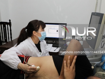 Young conscripts are attending a physical examination at a conscription medical examination station in Funing county, Yancheng city, East Ch...