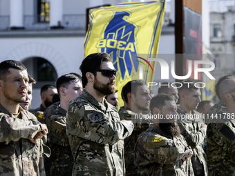 Servicemen of the Azov battalion are attending a ceremony to remember the victims of the Olenivka camp explosion, in Kyiv, Ukraine, on July...