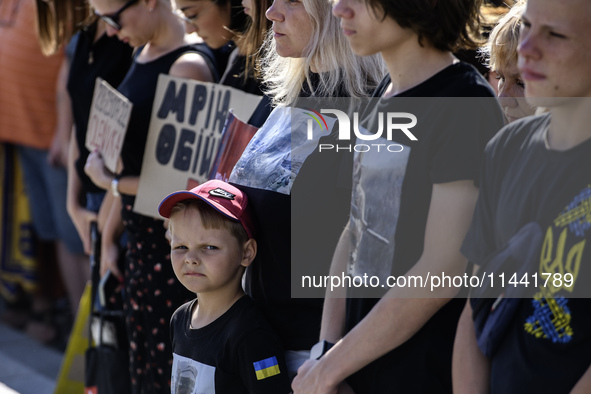 Ukrainian activists, relatives, and friends of soldiers who defended the Azovstal Iron and Steel Works are attending a ceremony to remember...