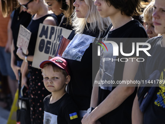 Ukrainian activists, relatives, and friends of soldiers who defended the Azovstal Iron and Steel Works are attending a ceremony to remember...