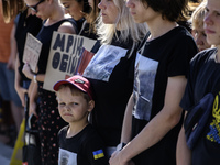 Ukrainian activists, relatives, and friends of soldiers who defended the Azovstal Iron and Steel Works are attending a ceremony to remember...