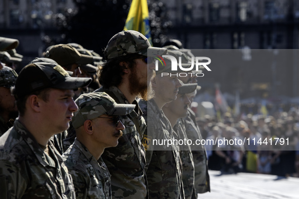 Servicemen of the Azov battalion are attending a ceremony to remember the victims of the Olenivka camp explosion, in Kyiv, Ukraine, on July...