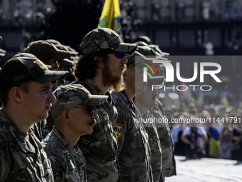 Servicemen of the Azov battalion are attending a ceremony to remember the victims of the Olenivka camp explosion, in Kyiv, Ukraine, on July...