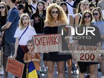 Ukrainian activists, relatives, and friends of soldiers who are defending the Azovstal Iron and Steel Works are holding placards calling on...