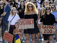 Ukrainian activists, relatives, and friends of soldiers who are defending the Azovstal Iron and Steel Works are holding placards calling on...