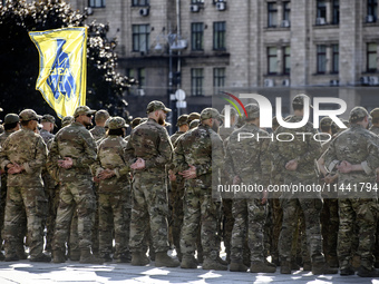 Servicemen of the Azov battalion are attending a ceremony to remember the victims of the Olenivka camp explosion, in Kyiv, Ukraine, on July...