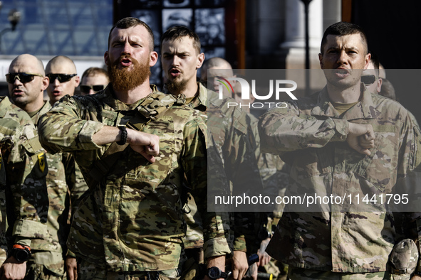 Servicemen of the Azov battalion are attending a ceremony to remember the victims of the Olenivka camp explosion, in Kyiv, Ukraine, on July...