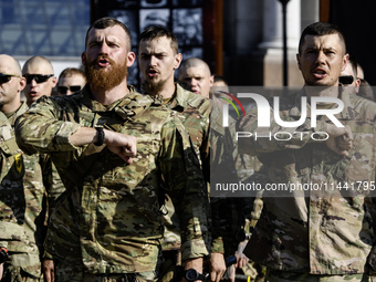 Servicemen of the Azov battalion are attending a ceremony to remember the victims of the Olenivka camp explosion, in Kyiv, Ukraine, on July...