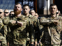 Servicemen of the Azov battalion are attending a ceremony to remember the victims of the Olenivka camp explosion, in Kyiv, Ukraine, on July...