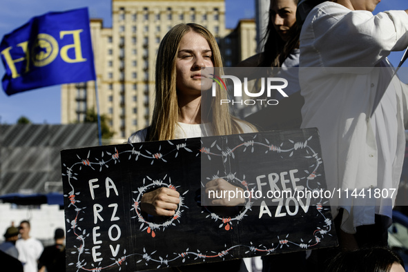 Ukrainian activists, relatives, and friends of soldiers who are defending the Azovstal Iron and Steel Works are holding placards calling on...