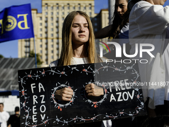 Ukrainian activists, relatives, and friends of soldiers who are defending the Azovstal Iron and Steel Works are holding placards calling on...