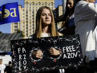 Ukrainian activists, relatives, and friends of soldiers who are defending the Azovstal Iron and Steel Works are holding placards calling on...