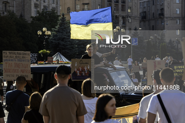 Ukrainian activists, relatives, and friends of soldiers who are defending the Azovstal Iron and Steel Works are holding placards calling on...