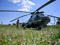 A flight engineer is checking the systems of a Mi-8MSB-V assault transport helicopter of the 16th Brody Separate Army Aviation Brigade in Uk...