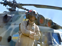 A flight engineer is standing by a Mi-8MSB-V assault transport helicopter of the 16th Brody Separate Army Aviation Brigade in Ukraine, on Ju...