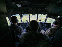 Crew members are in the cockpit of a Mi-8MSB-V assault transport helicopter of the 16th Brody Separate Army Aviation Brigade in Ukraine, on...