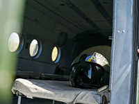 A flight helmet is being seen in a Mi-8MSB-V assault transport helicopter of the 16th Brody Separate Army Aviation Brigade in Ukraine, on Ju...