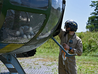 A flight engineer is checking the systems of a Mi-8MSB-V assault transport helicopter of the 16th Brody Separate Army Aviation Brigade in Uk...