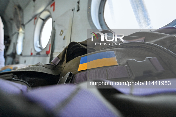 A Ukrainian flag patch is decorating a backpack of one of the crew members of a Mi-8MSB-V assault transport helicopter of the 16th Brody Sep...