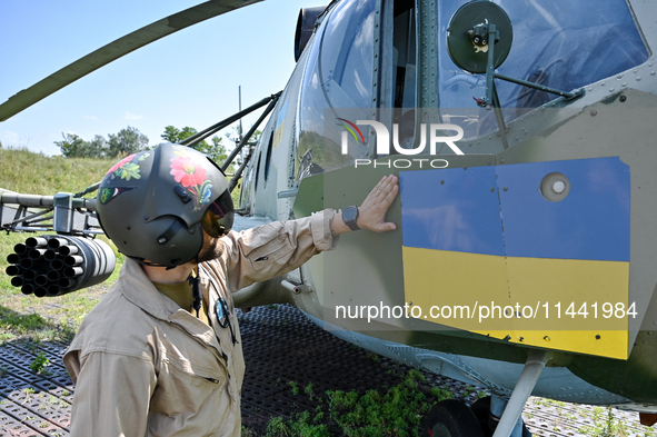 A flight engineer is checking the systems of a Mi-8MSB-V assault transport helicopter of the 16th Brody Separate Army Aviation Brigade in Uk...