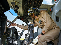 A flight engineer is checking the systems of a Mi-8MSB-V assault transport helicopter of the 16th Brody Separate Army Aviation Brigade in Uk...