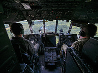 Pilots are in the cockpit of a Mi-8MSB-V assault transport helicopter of the 16th Brody Separate Army Aviation Brigade in Ukraine, on July 1...