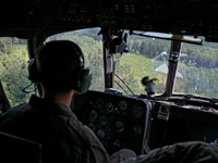 A 16th Brody Separate Army Aviation Brigade pilot is flying a Mi-8MSB-V assault transport helicopter in Ukraine, on July 11, 2024. NO USE RU...