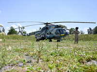 A flight engineer is standing by a Mi-8MSB-V assault transport helicopter of the 16th Brody Separate Army Aviation Brigade in Ukraine, on Ju...