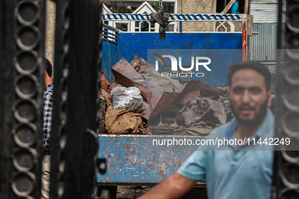 Government officials are inspecting the scrap site where 4 people died after an explosion in Sopore District, Baramulla, Jammu and Kashmir,...