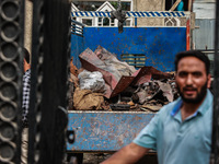 Government officials are inspecting the scrap site where 4 people died after an explosion in Sopore District, Baramulla, Jammu and Kashmir,...