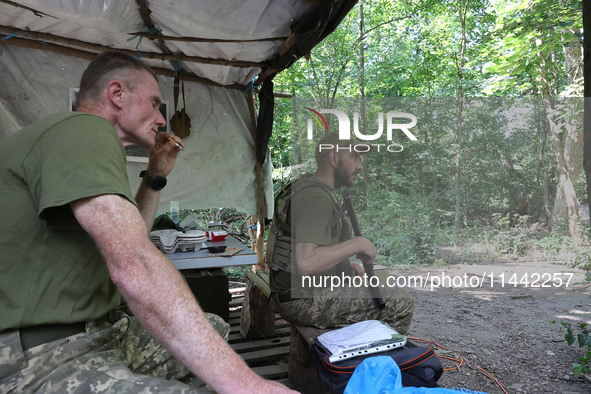 The Shkval (Squall) Battalion is resting in the tent in Ukraine, on July 26, 2024. Former prisoners who volunteered to defend Ukraine and we...