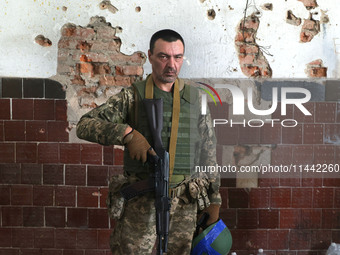 A serviceman who goes by the call sign Tkach is serving as a member of the Shkval (Squall) Battalion in Ukraine, on July 26, 2024. Former pr...