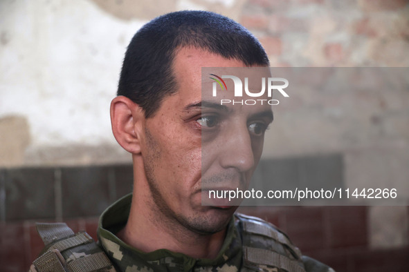 A serviceman who goes by the call sign Budulai is a Shkval (Squall) Battalion member in Ukraine, on July 26, 2024. Former prisoners who volu...