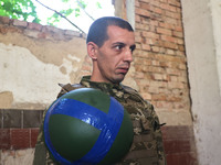 A serviceman who goes by the call sign Budulai is a Shkval (Squall) Battalion member in Ukraine, on July 26, 2024. Former prisoners who volu...