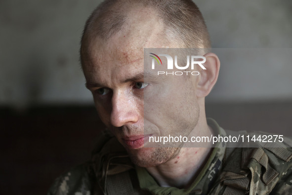 A serviceman who goes by the call sign Psykh is a Shkval (Squall) Battalion member in Ukraine, on July 26, 2024. Former prisoners who volunt...