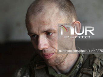 A serviceman who goes by the call sign Psykh is a Shkval (Squall) Battalion member in Ukraine, on July 26, 2024. Former prisoners who volunt...