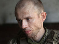 A serviceman who goes by the call sign Psykh is a Shkval (Squall) Battalion member in Ukraine, on July 26, 2024. Former prisoners who volunt...