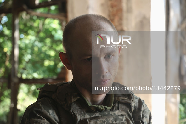 A serviceman who goes by the call sign Psykh is a Shkval (Squall) Battalion member in Ukraine, on July 26, 2024. Former prisoners who volunt...