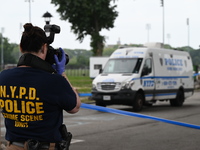 Three people are being shot, with one dead near a New York City-run migrant shelter on Randall's Island in Manhattan, New York, United State...