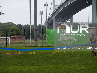 Three people are being shot, with one dead near a New York City-run migrant shelter on Randall's Island in Manhattan, New York, United State...