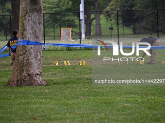 Three people are being shot, with one dead near a New York City-run migrant shelter on Randall's Island in Manhattan, New York, United State...