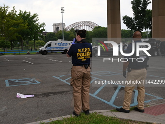 Three people are being shot, with one dead near a New York City-run migrant shelter on Randall's Island in Manhattan, New York, United State...